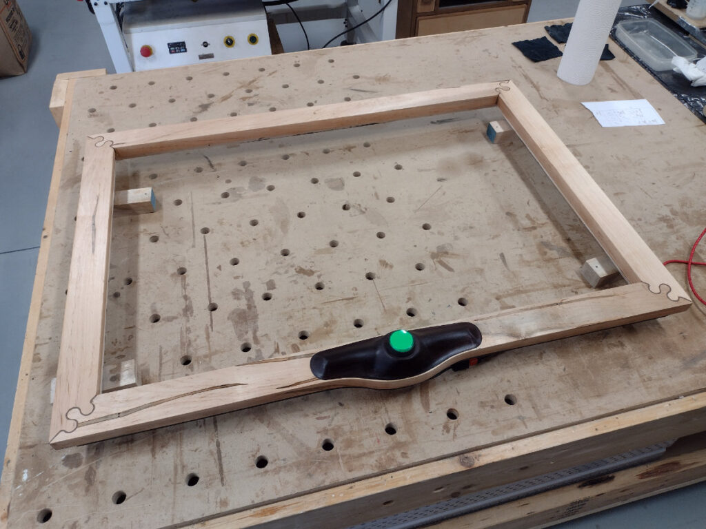 Maple frame with big green button