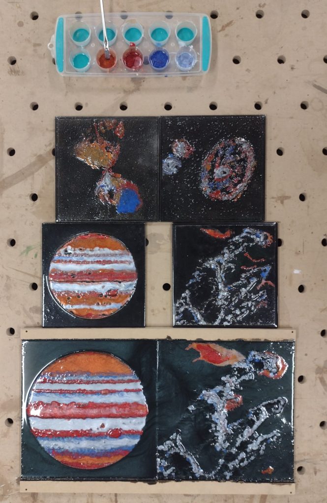 Coloured epoxy coated relief images of celestial objects
