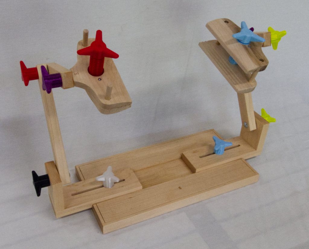 Two sided stand for holding stitching frames.