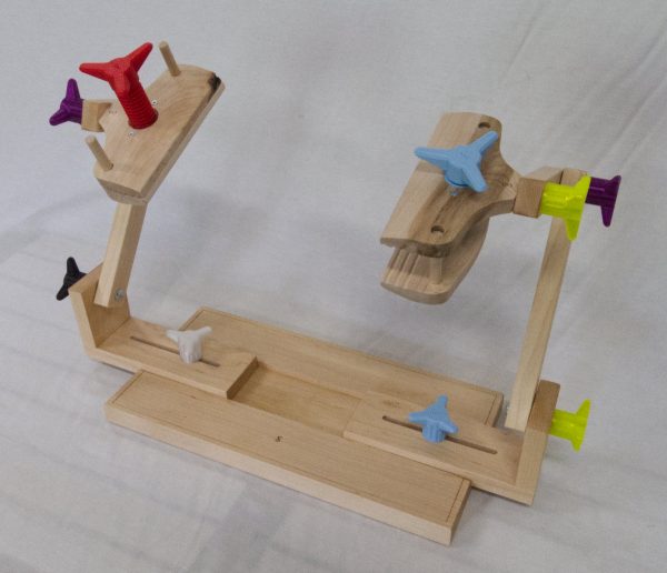 Two sided stand for holding stitching frames.