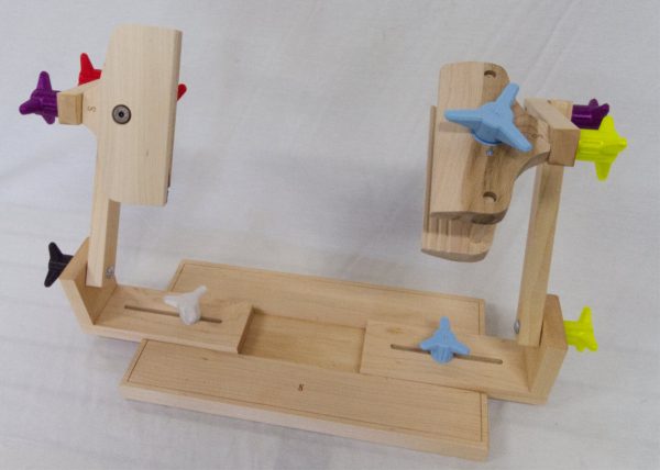 Two sided stand for holding stitching frames.