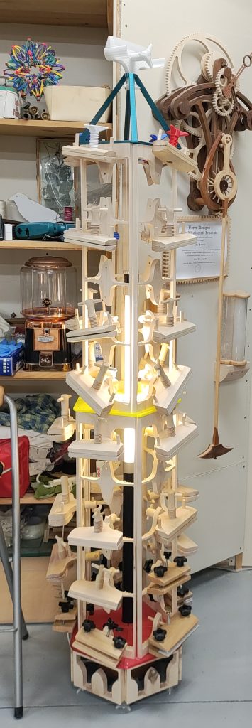 "Verklampt" sculpture in place and lit.